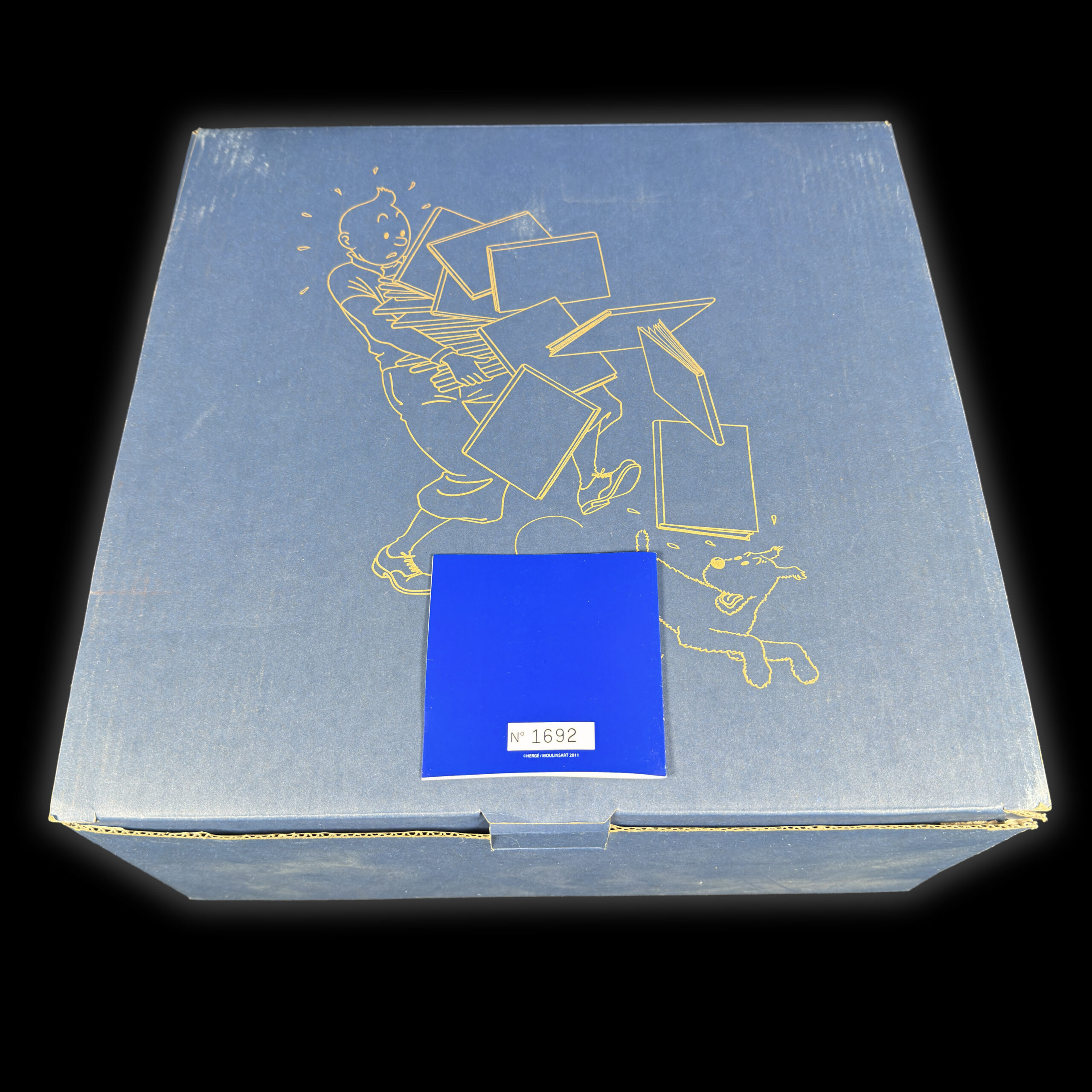 Tintin tenant les albums version 1