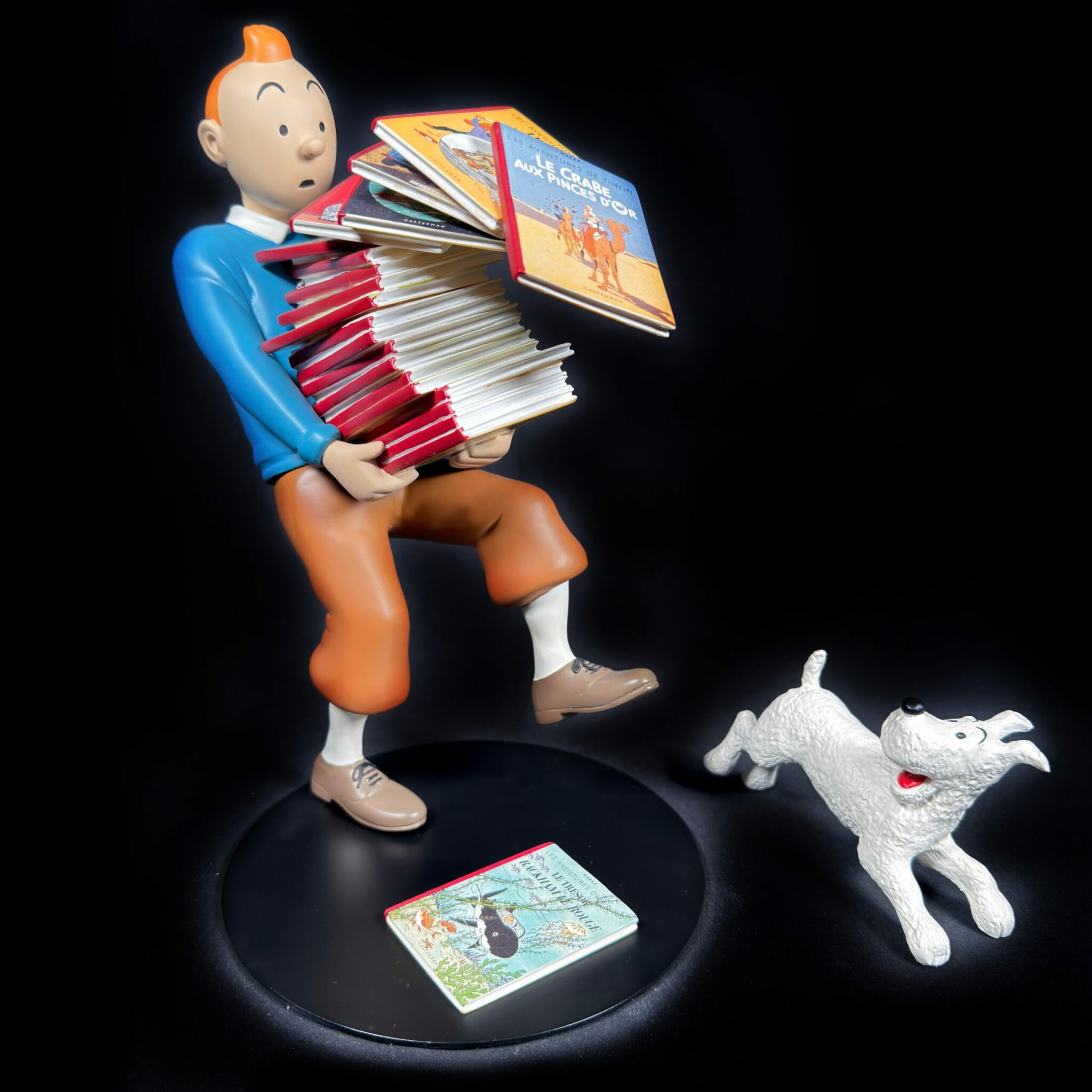 Tintin tenant les albums version 1