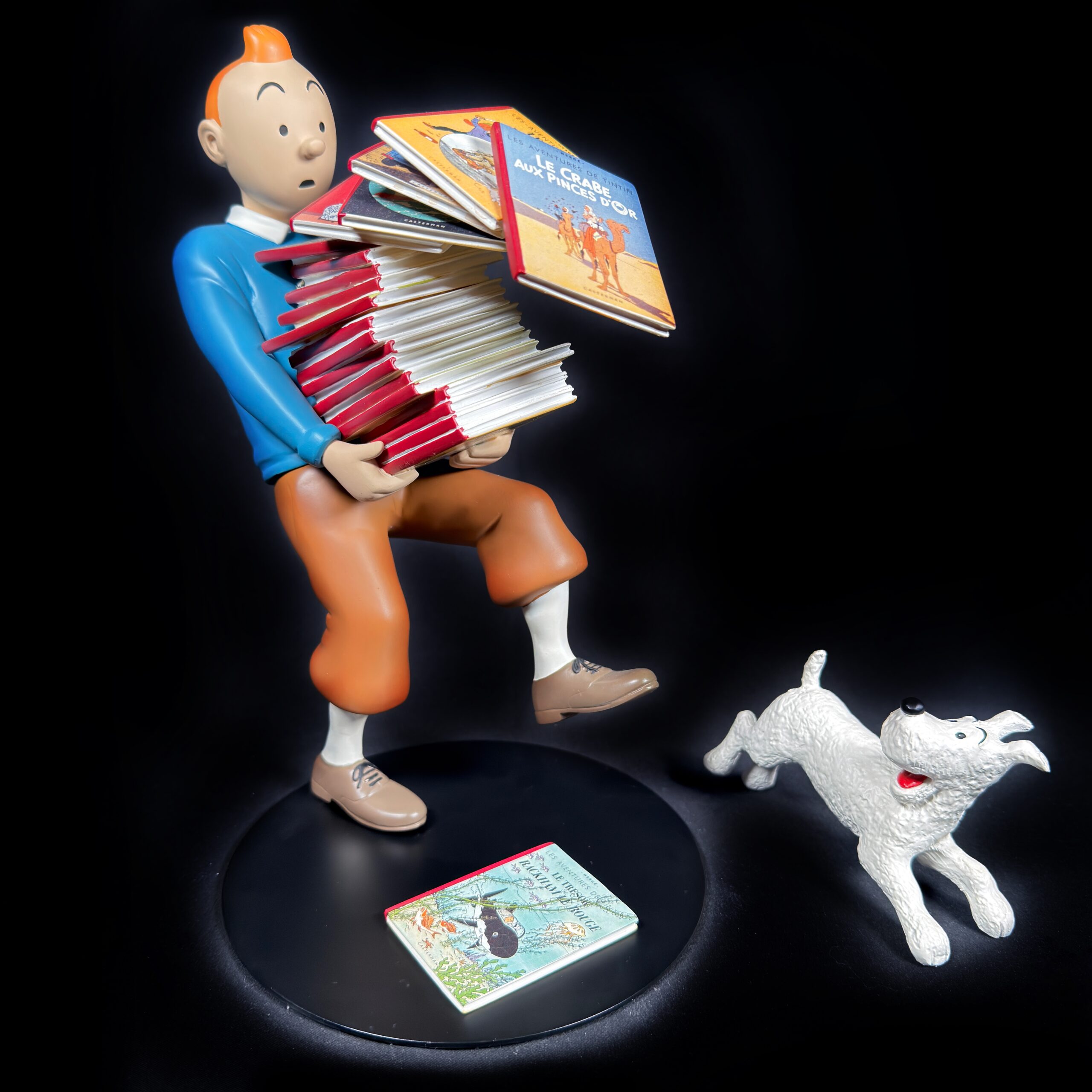 Tintin tenant les albums version 1